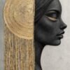 A profile silhouette with cascading gold-textured hair, set against a circular gold element, symbolizing spirituality, enlightenment, and inner grace.