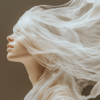 A woman with her eyes obscured by sheer fabric, creating an ethereal, dreamlike effect, her calm expression accentuating the beauty of stillness and grace.