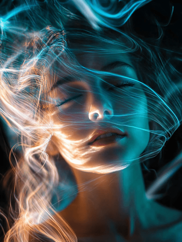 An abstract portrait of a figure with closed eyes, enveloped in flowing wisps of light in blue and gold, creating a dreamlike, serene atmosphere.